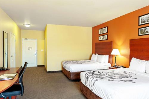 Ένα ή περισσότερα κρεβάτια σε δωμάτιο στο Sleep Inn & Suites Tyler South