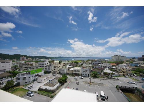 an aerial view of a city with buildings at Adan hotel in Nago
