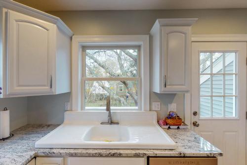 a kitchen with a sink and a window at Bella Luna in Falmouth