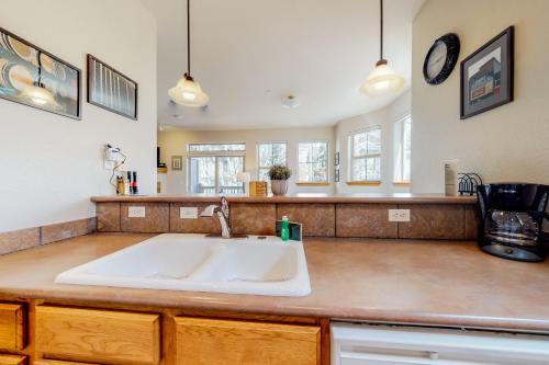 a kitchen with a sink and a counter top at Tarn Landing B7 in Frisco