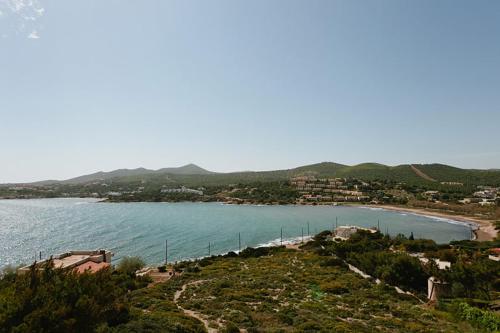 a view of a body of water with a beach at Hidesign Athens Villa In Sounio in Sounio