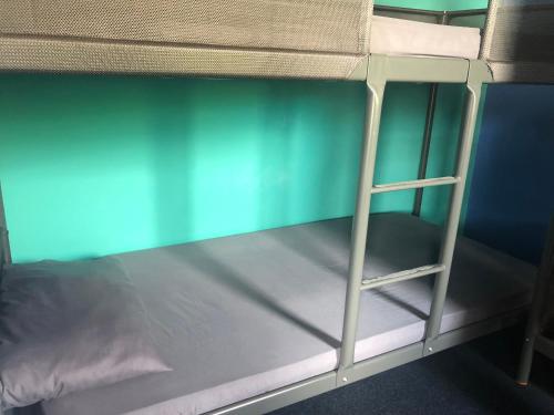 A bunk bed or bunk beds in a room at Bwn Bed Station