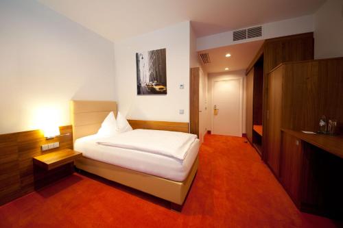 Postel nebo postele na pokoji v ubytování Business Hotel Ambio Gleisdorf