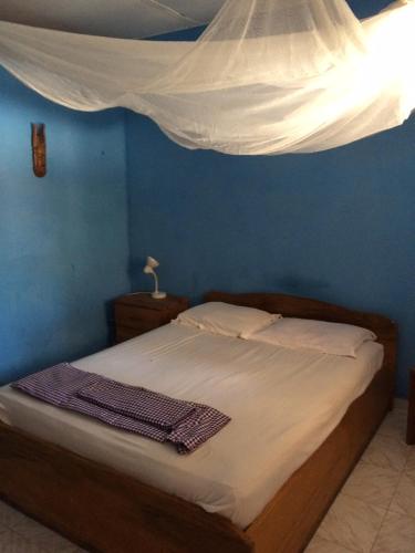 מיטה או מיטות בחדר ב-N'Danthiéné Lodge