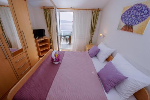 Postel nebo postele na pokoji v ubytování Pension Maric Rooms