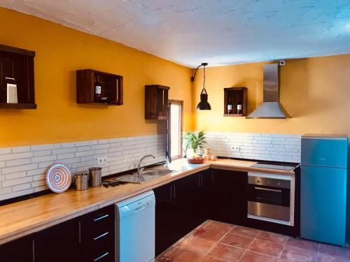 a kitchen with a sink and a counter top at Finca Can Jordi in Felanitx