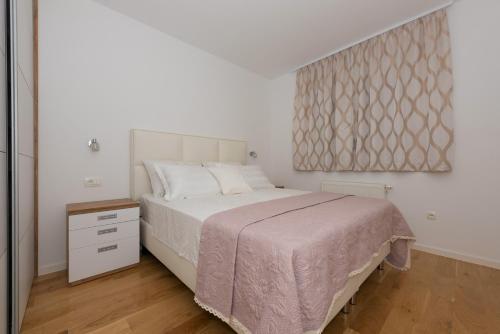 Postel nebo postele na pokoji v ubytování Penthouse Jure