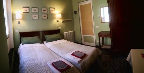 Un pat sau paturi într-o cameră la Lavagna Uno