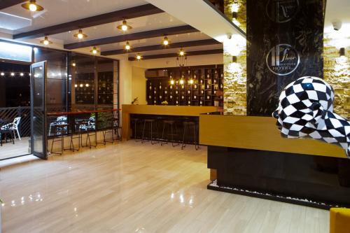 a restaurant with a dance floor and a bar at Boutique Hotel in Tbilisi City