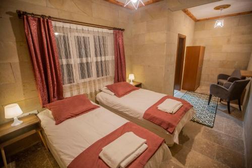 Postel nebo postele na pokoji v ubytování Capiedra Hotel