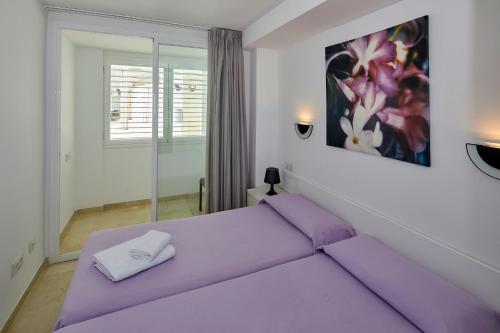 Katil atau katil-katil dalam bilik di Apartamentos Centremar