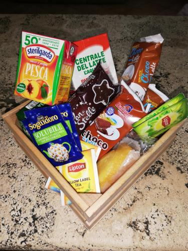 a tray filled with different types of snacks on a counter at La Casa di Lucia in LʼAquila