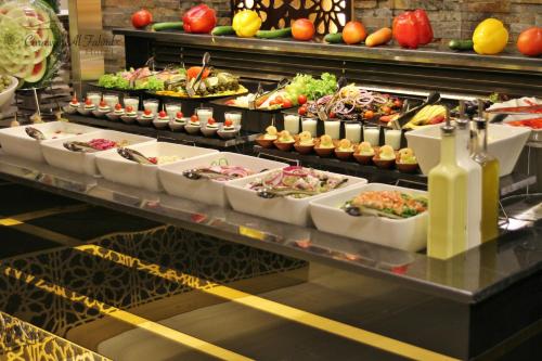 a buffet line with many different types of food at Carawan Al Fahad Hotel in Riyadh