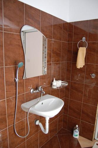 a bathroom with a sink and a mirror at The White House in Karlovo