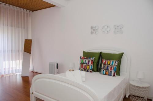 Postel nebo postele na pokoji v ubytování Casa do Relógio