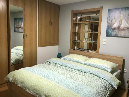 a bedroom with a bed with two pillows at Studios Magnolia in Trogir