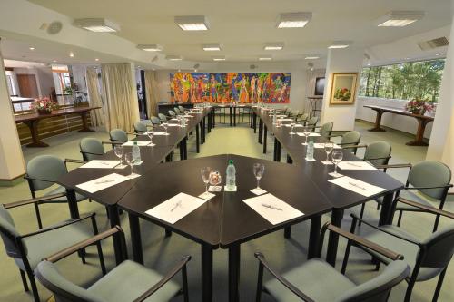 a large conference room with a long table and chairs at Hotel del Lago Golf & Art Resort in Punta del Este