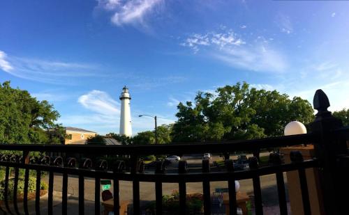 a view of a lighthouse from a balcony at Ocean Inn & Suites in Saint Simons Island