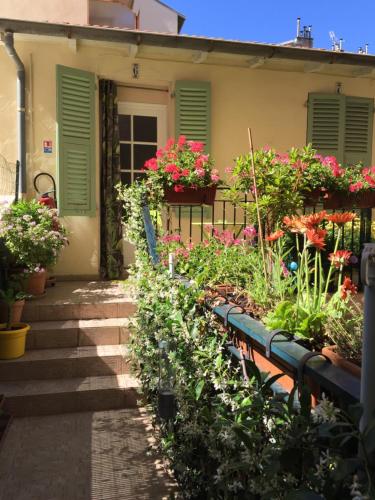a house with flower boxes on the front porch at Hotel des Dames in Nice