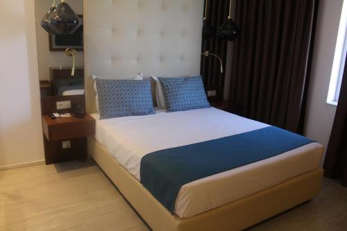 Cama o camas de una habitación en Afrin Prestige Hotel