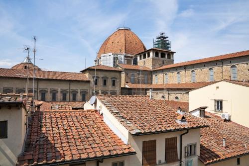 a view of roofs of a city with a building at On the Duomo - Super Chic in Florence