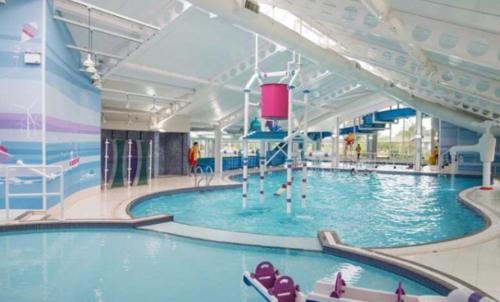 a large swimming pool in a large building at Edinburgh, seton sands in Port Seton