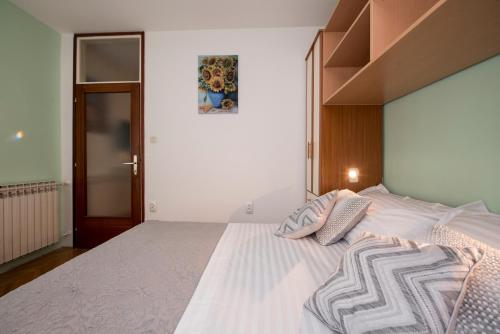 Posteľ alebo postele v izbe v ubytovaní Apartment Pax