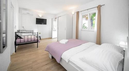 Postel nebo postele na pokoji v ubytování Sunshine Apartment Sovlje