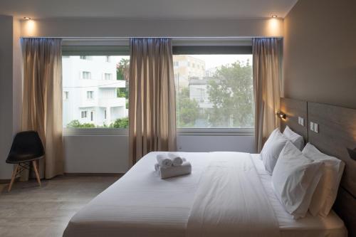Кровать или кровати в номере Sette Suites & Rooms - Adults Only