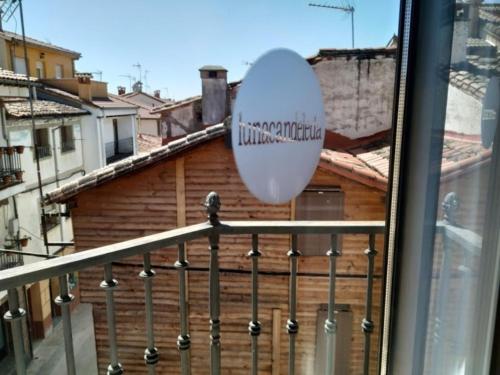 a baseball ball on a railing of a balcony at Hostal Rural Luna y Hostal Rural Lunaposada in Candeleda