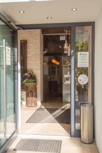 an entrance to a store with the door open at Haus Sommerhof in Sindelfingen