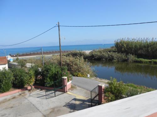 a view of a river with the ocean in the background at Marie in Sidari