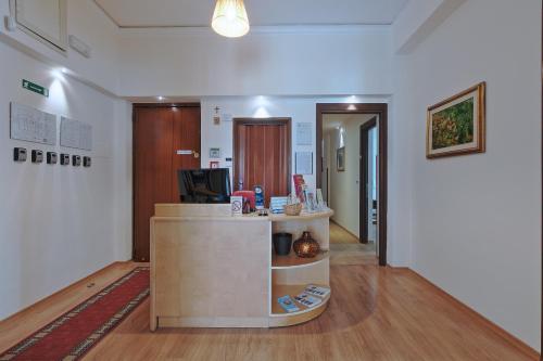 an office with a reception desk in a room at Residenza Wagner in Palermo