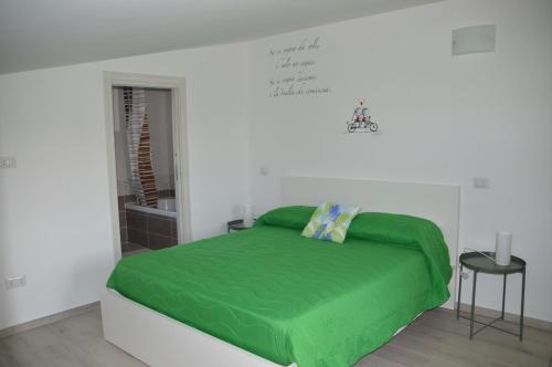 Ένα ή περισσότερα κρεβάτια σε δωμάτιο στο La Maison di Sara