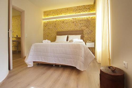 Ένα ή περισσότερα κρεβάτια σε δωμάτιο στο Liston Inn Suites(Plaza) - Heart of Corfu Old Town