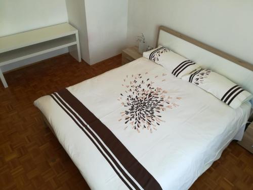 a bed with two pillows on it in a room at B&B Stadio Apartment in Pordenone