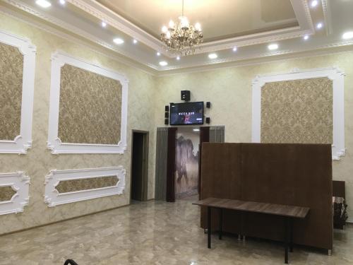 TV a/nebo společenská místnost v ubytování Hotel Triumph