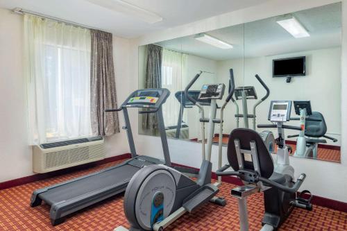 a gym with cardio equipment in a hotel room at Howard Johnson by Wyndham Rock Hill in Rock Hill