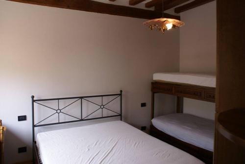 Кровать или кровати в номере Casa Poli Bolzoni