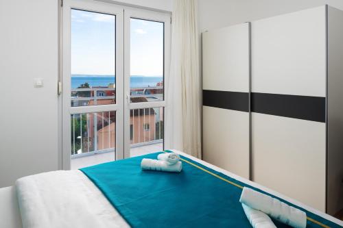 Posteľ alebo postele v izbe v ubytovaní Lotus Apartman
