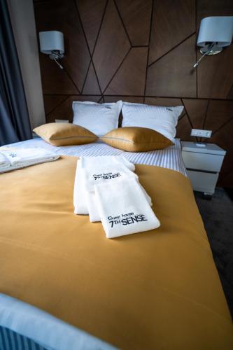 Ένα ή περισσότερα κρεβάτια σε δωμάτιο στο Boutique Guest house 7th Sense