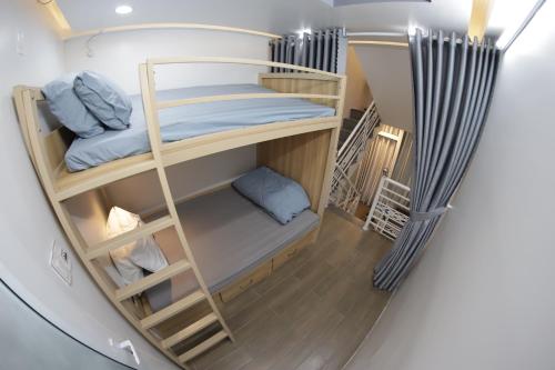 Postel nebo postele na pokoji v ubytování NGOC LINH HOMESTAY - nhà nguyên căn