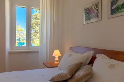 Katil atau katil-katil dalam bilik di Apartments Ivona