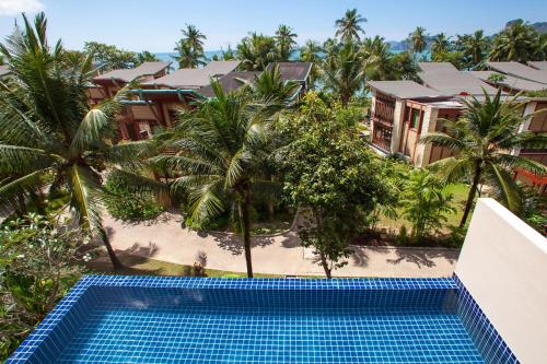 an overhead view of a swimming pool in front of a resort at Amatapura Villa 26 in Ao Nam Mao