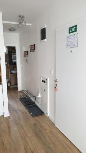 an empty room with an exit sign on the wall at Apartman Four Seasons Kopaonik in Kopaonik