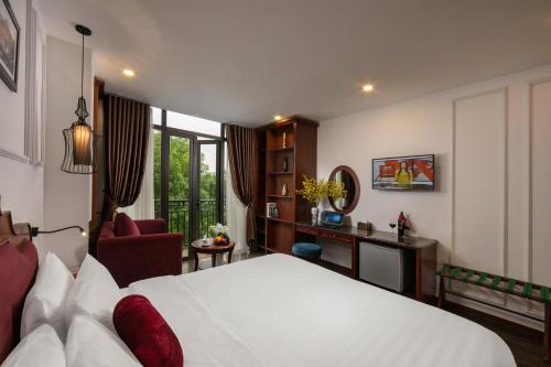 Giường trong phòng chung tại Vision Premium Hotel