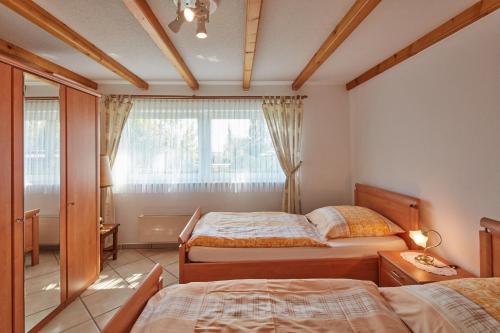 Postel nebo postele na pokoji v ubytování Ferien- und Messewohnung/ Apartment