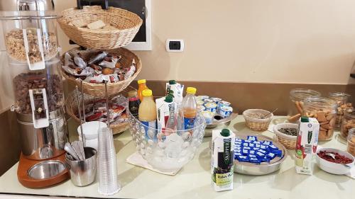 a counter top with many different items on it at Riviera Hotel in Enna