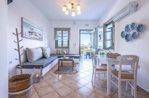 a living room with a couch and a table at Mirabeli Apartments & Suites in Pollonia