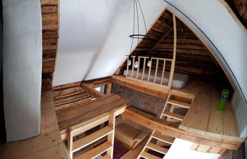 an overhead view of a large wooden room with a staircase at Ventspils Garden house in Ventspils